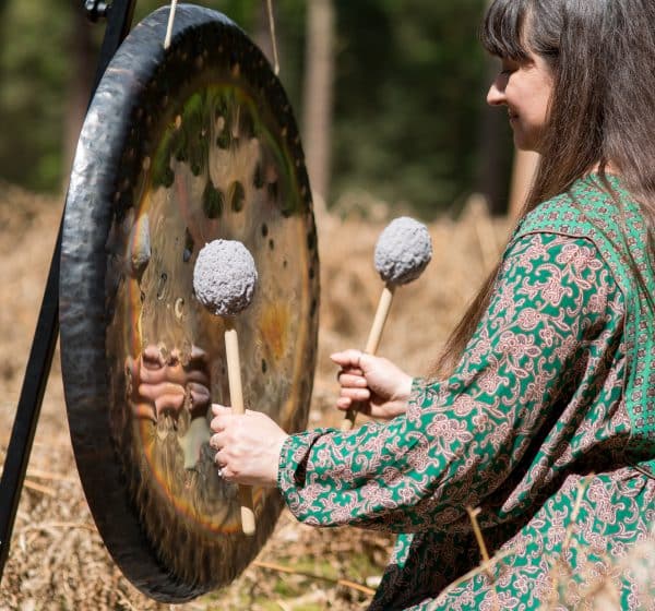 Gong playing at the wellness day at Holkham, north Norfolk