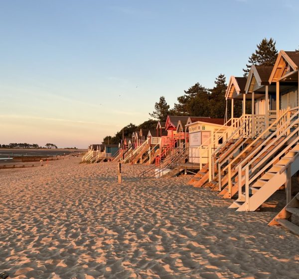 Sunrise on Wells Beach, with the colourful beach huts on the right