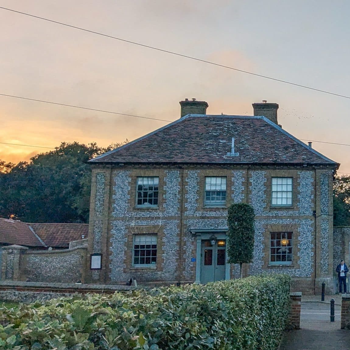 The Victoria hotel exterior at sunset