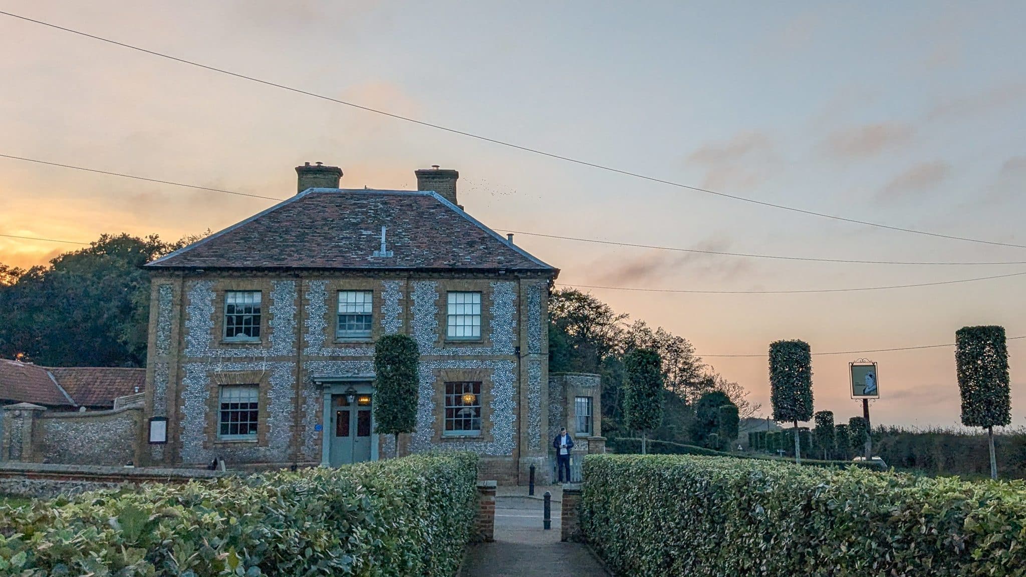 The Victoria hotel exterior at sunset