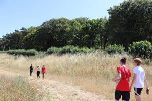 School pupils enjoying Monica's Meadow during a school trip at Holkham.