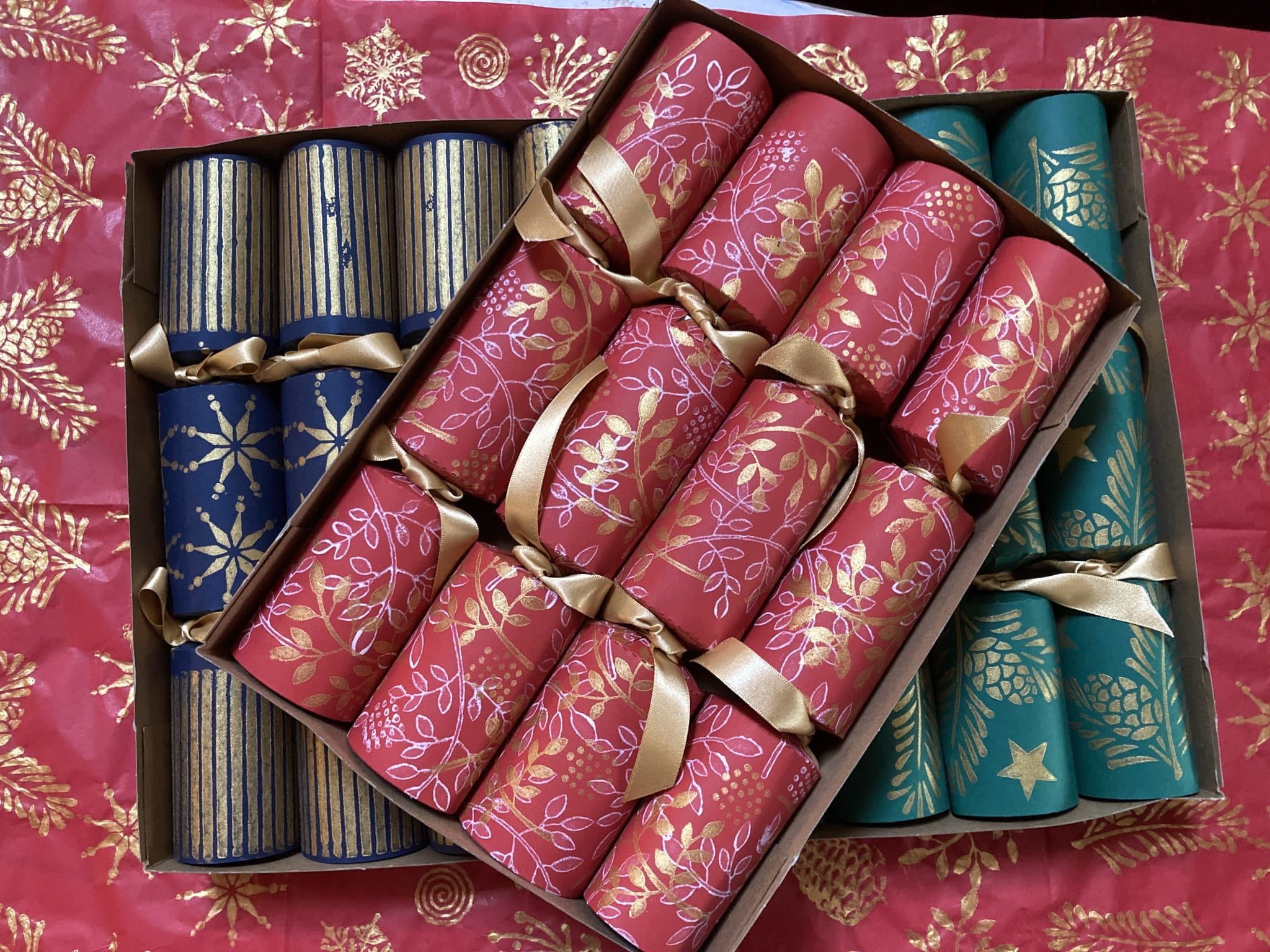 Red, green and blue handmade Christmas Crackers