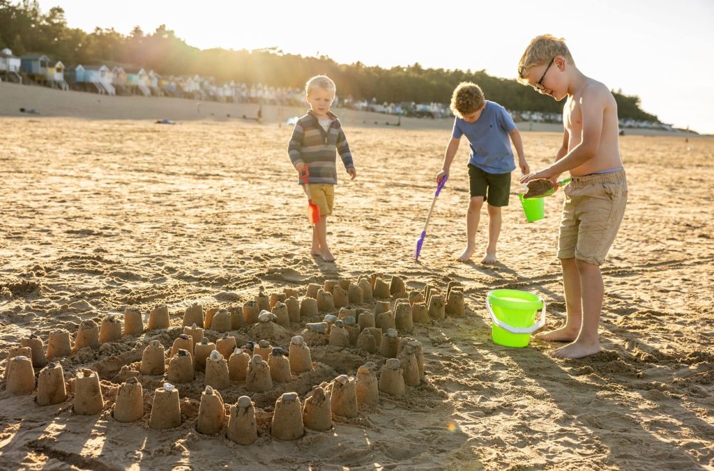 children playing on wells beach