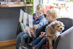 Children and their dog in Pinewoods sales office